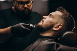 demo-attachment-871-handsome-man-cutting-beard-barber-salon